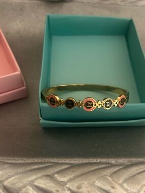 Gold Tone Women's Bangle Bracelet with Pink and Black Enamel Accents